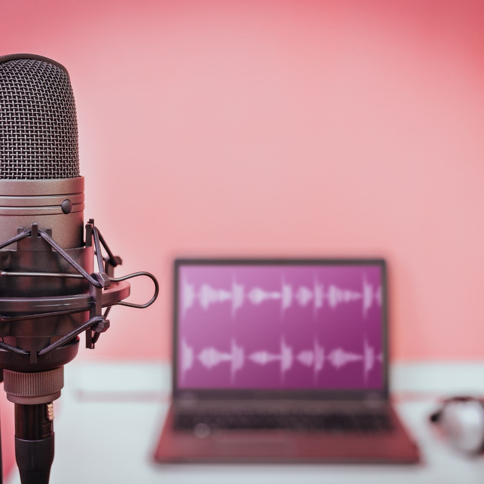 Doris Cush _ podcast microphone with pink background _Blog Post Featured Image 1600 x 1600